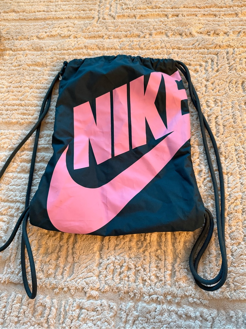 Nike Black Drawstring Backpack with Pink Logo